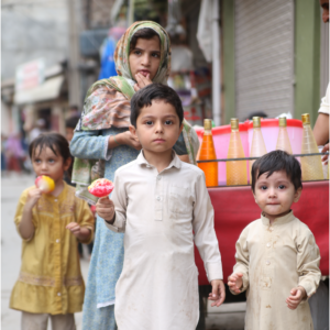Children in a street enjoying a snack