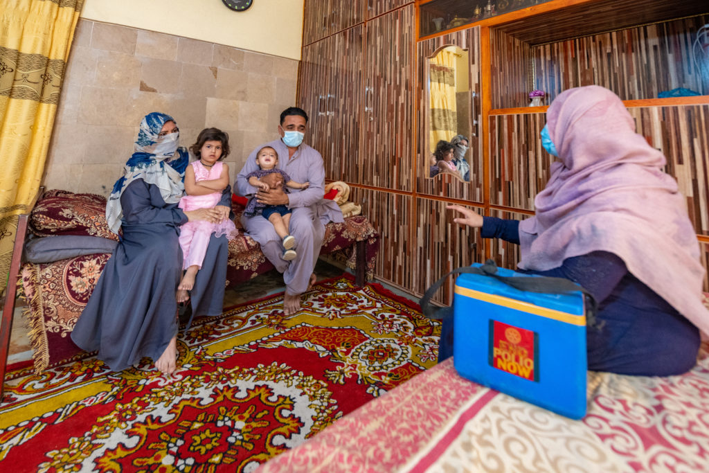 Izzat Begum, a female polio community worker visits a family in Karachi who were hesitating to vaccinate their children. After listening to their concerns, she was able to clarify their doubts and convince them to vaccinate their two girls under the age of five.